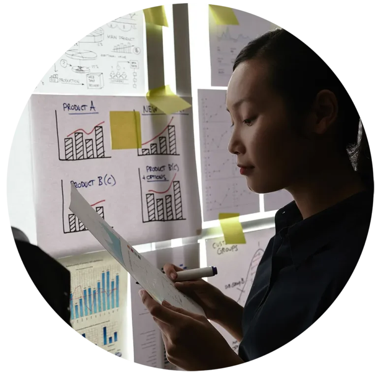 male-female-colleagues-standing-by-glass